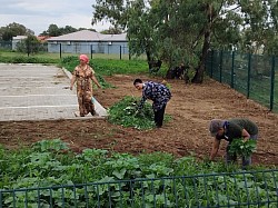 Community members cleaning library voluntary